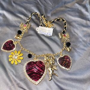 Retro type necklace with pink and black zebra striped hearts $60